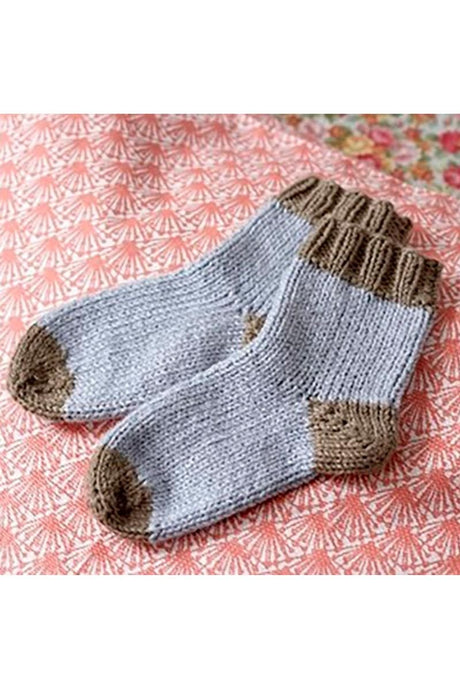 Babyvest, sokker og bamse